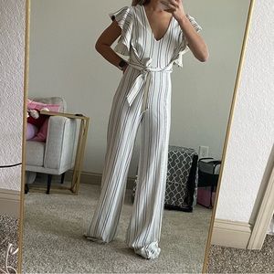 XS white and black striped Fashion Nova jumpsuit. NWT